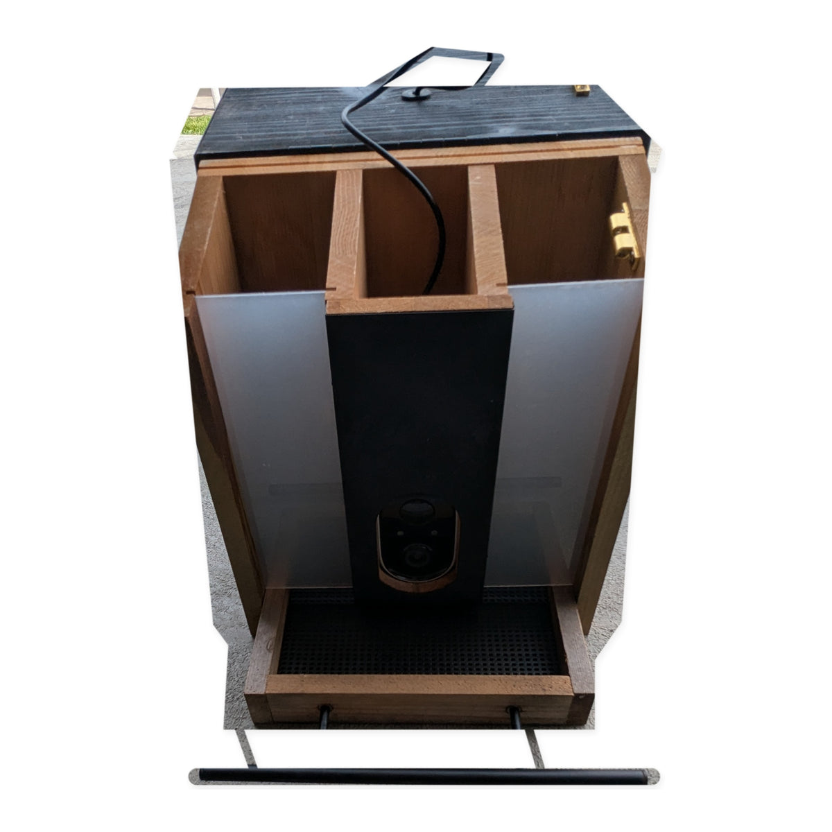 Front view of the actual Evergreen smart bird feeder with open seed compartments on studio white