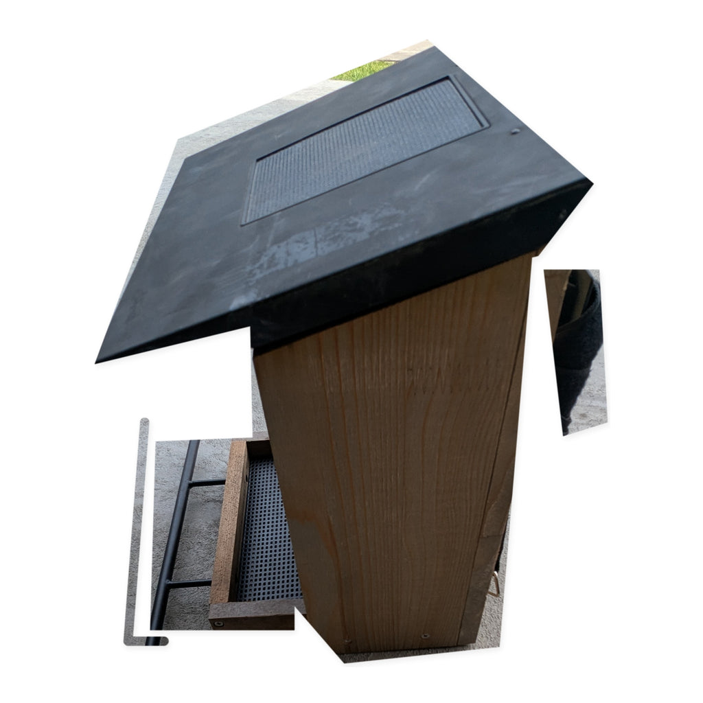Rear-right view of the actual Evergreen smart bird feeder on studio white