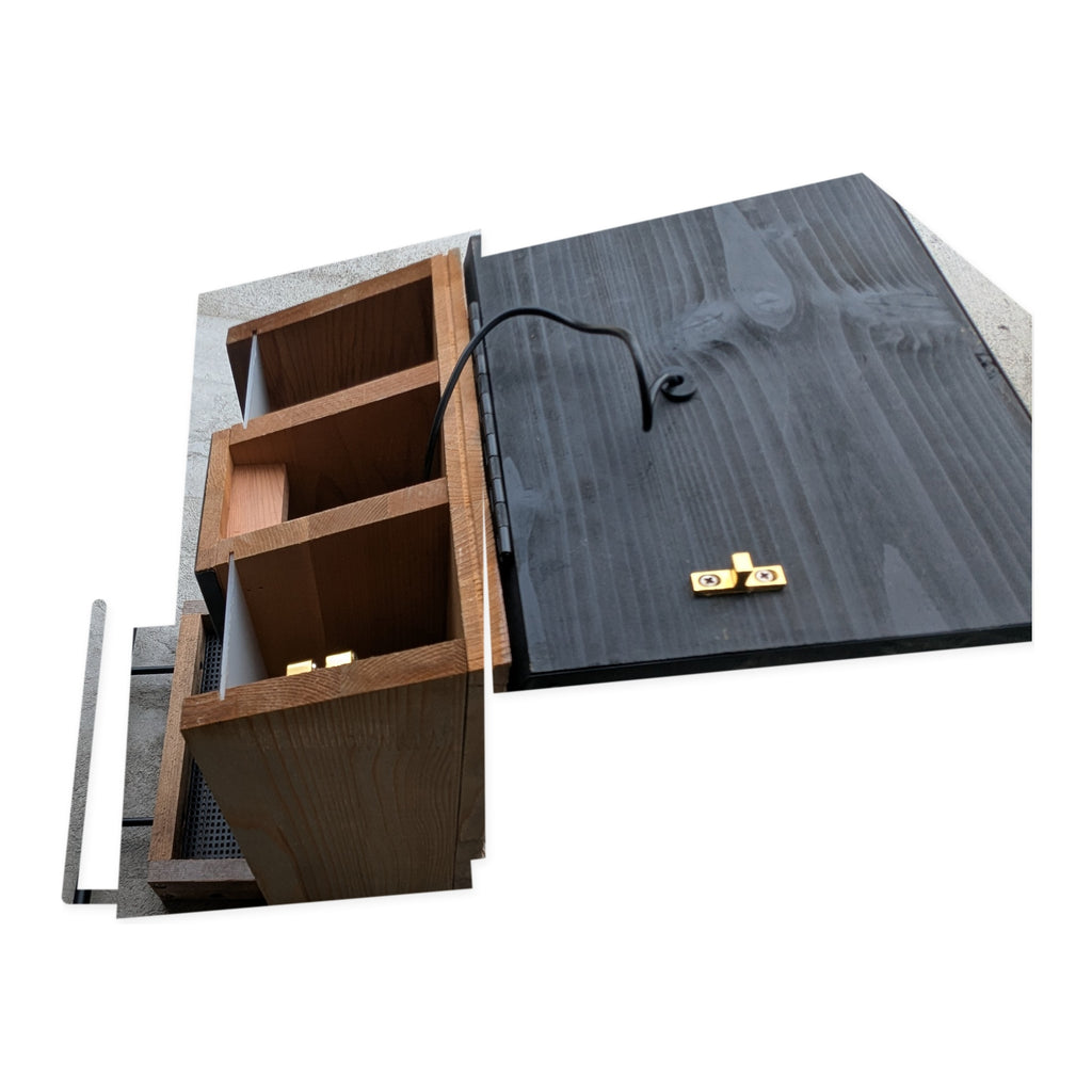 Open view of the actual Evergreen smart bird feeder compartments and lid on studio white