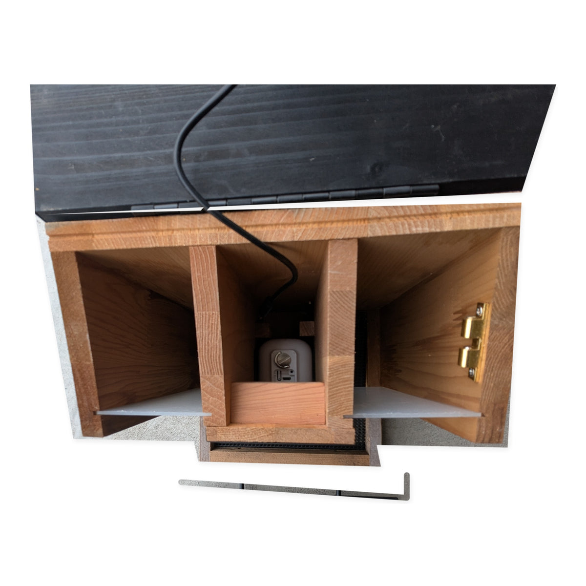 Close-up of the actual Evergreen smart bird feeder compartments and internal camera hardware on studio white