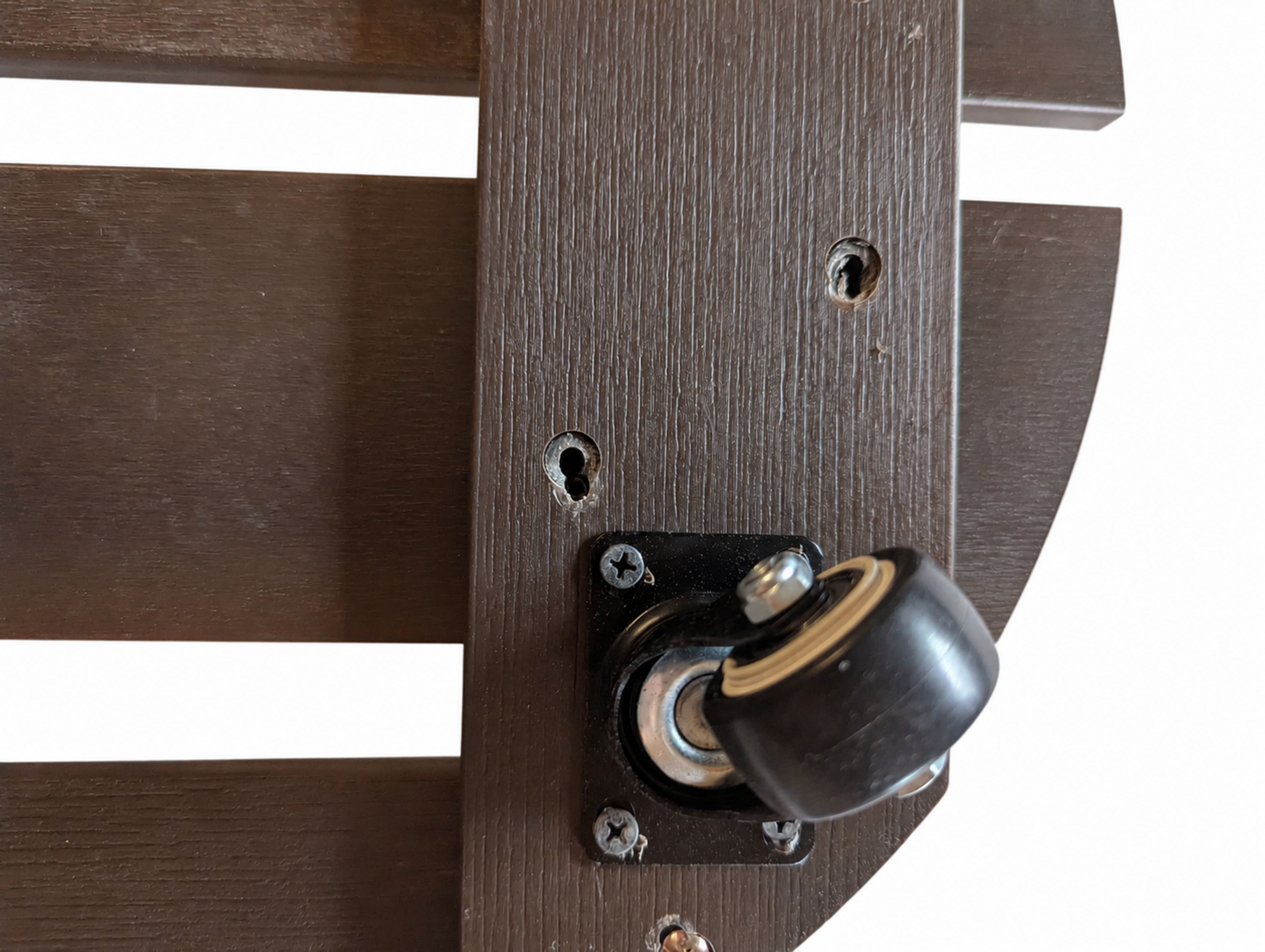 Close-up of caster and faux-wood surface on Stylecraft plant caddy on studio white