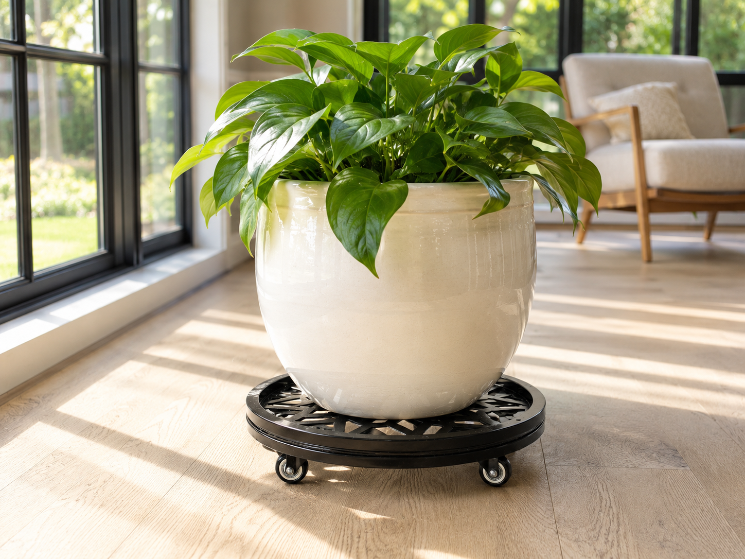 Stylecraft black steel plant caddy supporting a planter in a bright sunroom