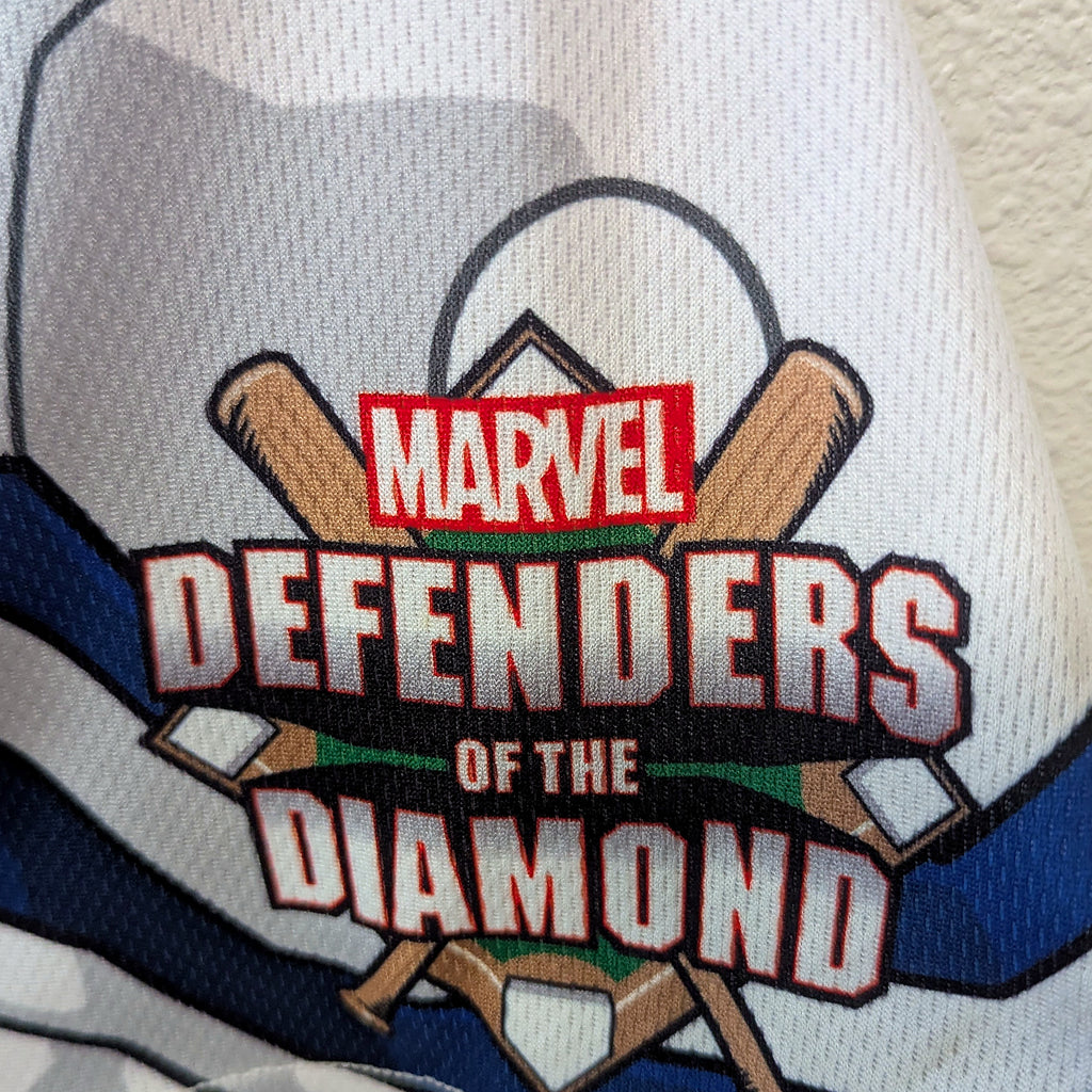 Close-up of the Marvel Defenders of the Diamond sleeve patch on the game-worn Dust Devils jersey