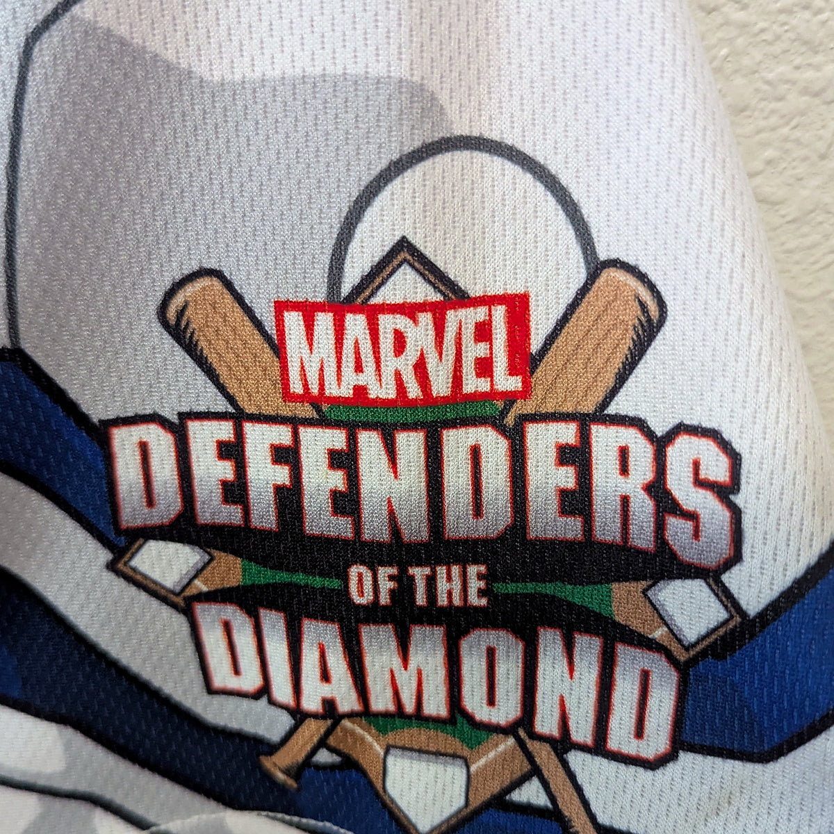 Close-up of the Marvel Defenders of the Diamond sleeve patch on the game-worn Dust Devils jersey