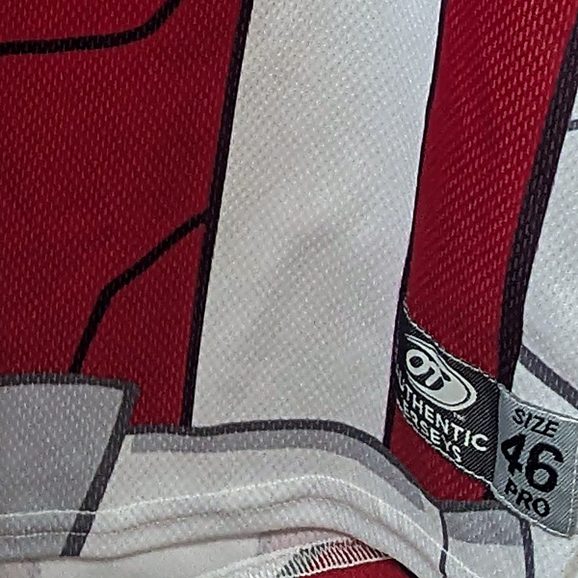 Close-up of the OT Sports Authentic Jerseys size 46 Pro tag on the game-worn Dust Devils jersey